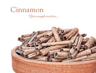 Cinnamon heap at white