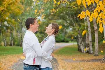 Fototapeta premium Romantic young beautiful couple on autumn walk