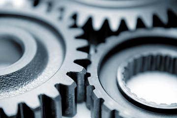 Close up of three steel cog gears