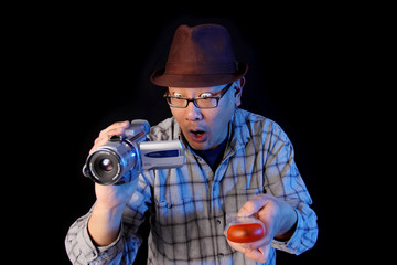 Ghost hunter with a video camcorder and EMF detector.