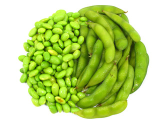 Edamame soy beans shelled and pods on white background