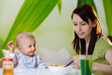 mother feeding baby