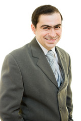 A successful businessman smiling on white background.