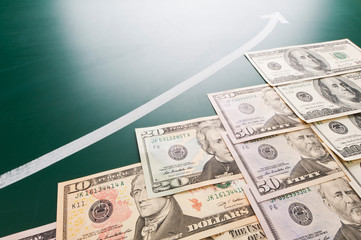 American banknotes and growing arrow