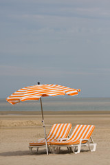 Beach chairs and umbrella