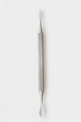 Manicure spatula on a white background