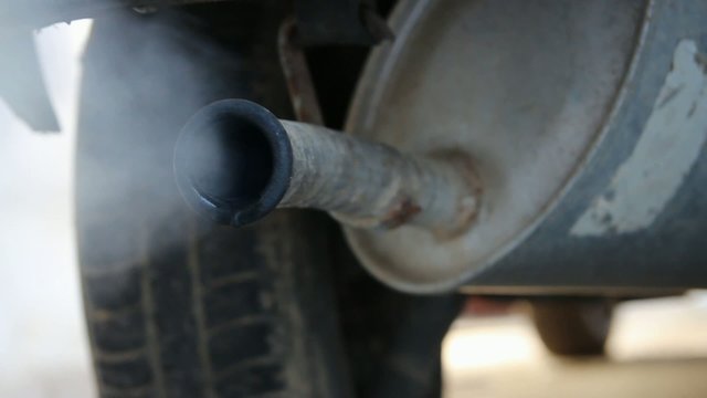 car exhaust dripping and blowing vapour