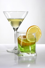Two green cocktail and lemon