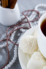 heart-shaped chocolates with candies in coconut flakes of beads