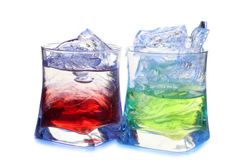 Glasses of red and green cocktail