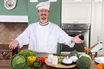Young chef preparing lunch in kitchen