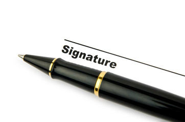 Pen and signature isolated on white