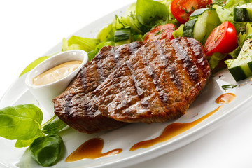 Grilled steaks and vegetables