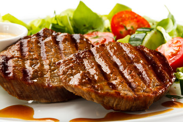 Grilled steaks and vegetables