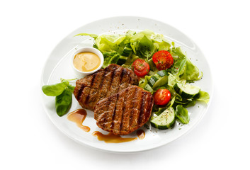 Grilled steaks and vegetables