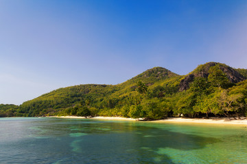 Fototapeta premium A small tropical beach by the hill.