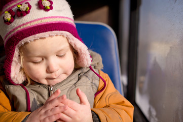 Cute baby riding bus on seat place