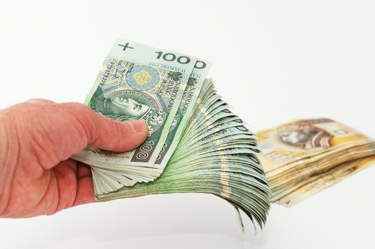Rozłożone banknoty w dłoni