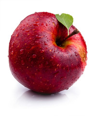 One Juicy red apple with leaves and water droplets
