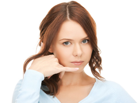 woman making a call me gesture