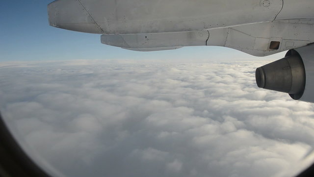 flying above clouds and airplane illuminator