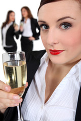 businesswoman drinking champagne