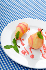 Dessert with pear in sauce