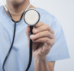 male doctor holding stethoscope