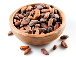 Cocoa Beans in the wooden pot isolated on a white background