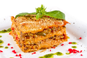 Closeup of lasagna and basil fork