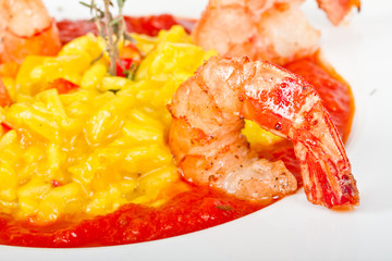 Plate of Shrimps Risotto garnished with fresh parsley and Parmes