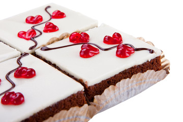 cakes with jelly hearts on isolated white