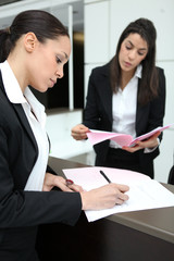 Female director signing contract