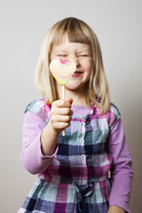 Little girl with lollipop