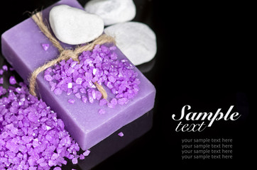 Obraz na płótnie Canvas Purple handmade soap and white stones