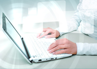 Laptop against technology background