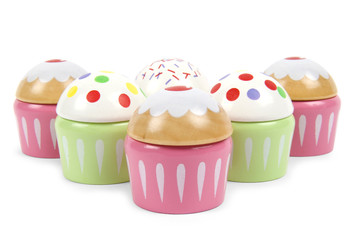 Six beautiful toy cupcakes on white background