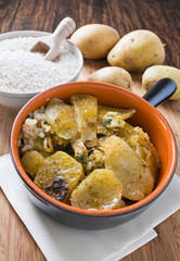 Tiella of potatoes, rice and mussels.