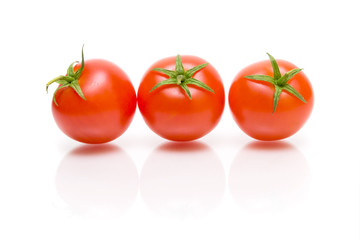 three tomatoes on a white background
