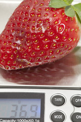 Weighing a strawberry
