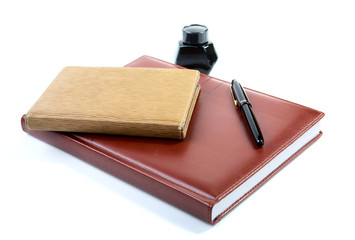 Leather organizer a pen and ink isolated on  white background