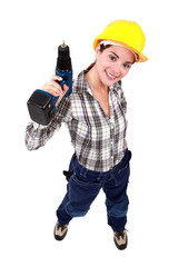 Woman with a cordless drill