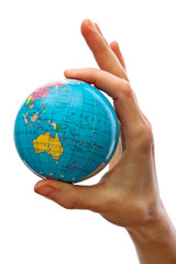 Hand taking a globe