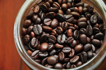 Fototapeta premium close up coffe berry in bottle