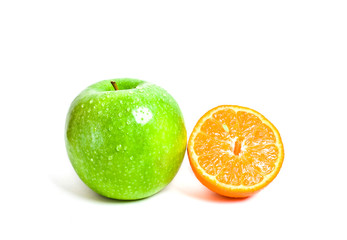 Juicy cut orange and green apple