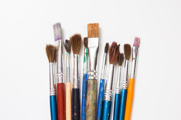 Set of  old paint brushes on a white background.