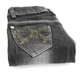 A pair of grey jeans on a white