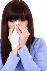 woman blowing her nose