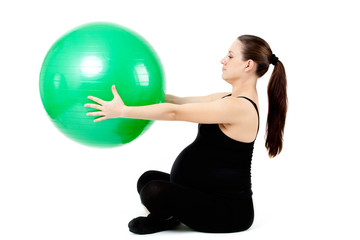 Pregnant woman excercises with gymnastic ball. Beautiful pregnan