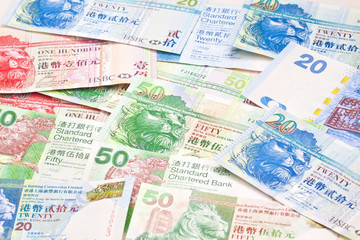 Fototapeta na wymiar Hong Kong currency with different dollars background